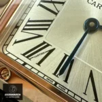 Detailed View of Super Clone Cartier Santos Dumont Large W2SA0011 Watch, Featuring Black Hour Markers on the Dial