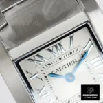 Close-up of part of the dial of the Super Clone Cartier Tank Francaise Watch dupe, highlighting the metallic hour markers and blue hands