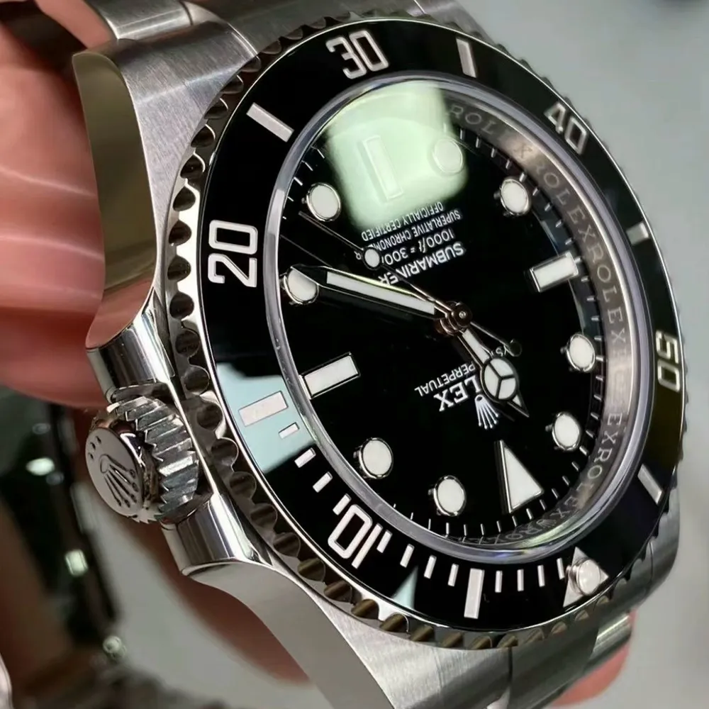 Detailed view of the crown and bezel markings on the Super Clone Rolex Submariner No Date 114060 watch.