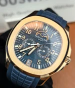 Macro close-up of the blue dial on the Patek Philippe Aquanaut Luce 5261R — textured dial surface, applied hour markers and date window visible.