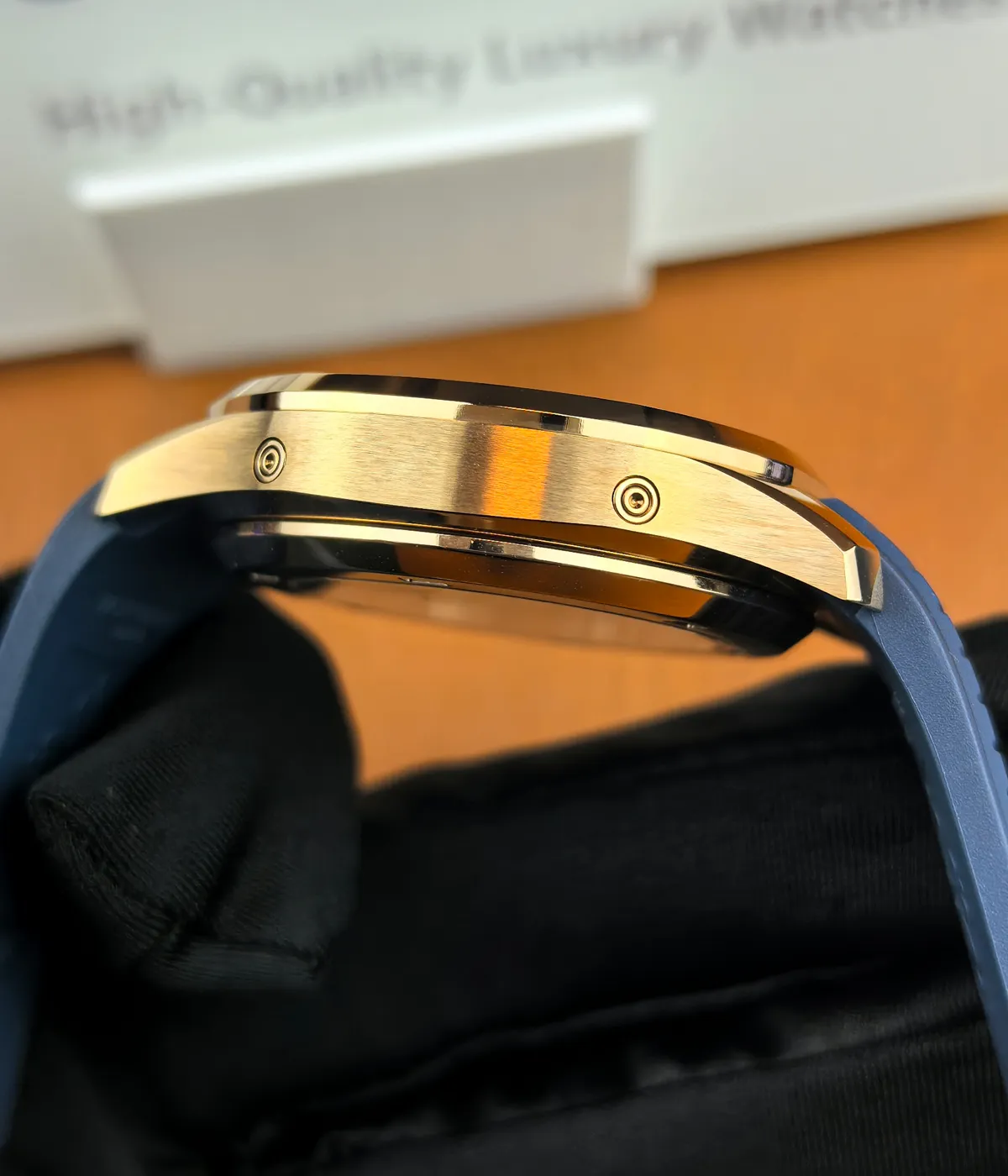 Side view of Patek Philippe Aquanaut Luce 5261R — rose gold case showing satin-brushed surfaces and polished chamfers.