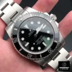 Super Clone Rolex Submariner No Date 114060 watch resting in the palm of a hand.