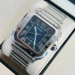 45-Degree Front View of Super Clone Cartier Santos Blue Dial WSSA0071 Watch with Stainless Steel Case and Blue Dial