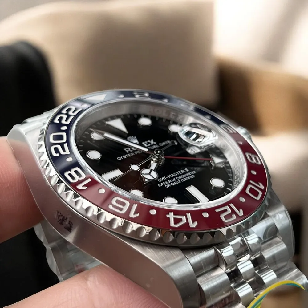Flat lay display of Super Clone Rolex Pepsi GMT Master II watch