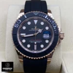 Front view of the Super Clone Rolex Yacht-Master 40 watch with a rose gold case, black dial, and rubber strap