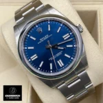 Replica Rolex Oyster Perpetual Date Blue watch displayed at a 120-degree angle, emphasizing the vibrant blue dial and the refined Oystersteel case.