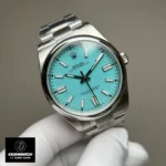 Replica Rolex Tiffany Blue Dial 124300 watch at a 120-degree angle, focusing on the captivating Tiffany Blue dial and the refined design.