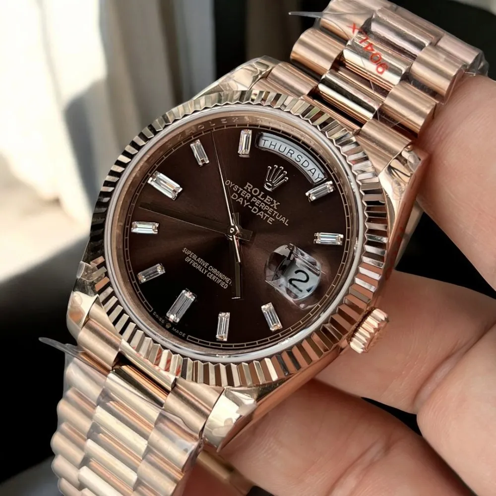Super Clone Rolex Day Date 40 Rose Gold Watch displayed at a 45-degree angle