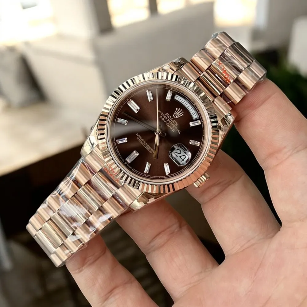 Super Clone Rolex Day Date 40 Rose Gold Watch m228235 displayed at a 45-degree angle, emphasizing the exquisite rose gold case and chocolate dial.