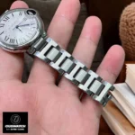 Cartier Ballon Bleu 33mm Watch stainless steel bracelet close-up.