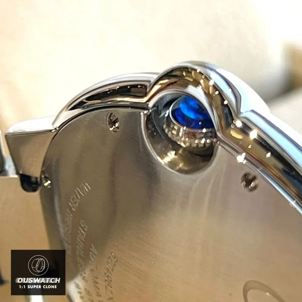 Back view of the Cartier Ballon Bleu 33mm Watch crown, featuring a blue sapphire cabochon that resembles a floating blue balloon.