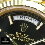 Replica Rolex Day Date 40 Black Dial Watch close-up, focusing on the meticulously crafted bezel and striking black dial.