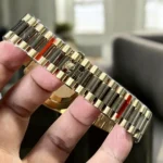 Top Replica Gold Rolex Green Face Day Date 40 Watch with President bracelet, showcasing the iconic bracelet and premium green dial.