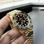 Black and Grey Ceramic Bezel on Rolex GMT Master II 126718GRNR with 18KT Gold Case