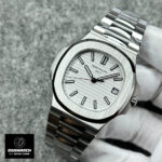 Patek Philippe Nautilus 5711/1A with white dial showcased at a 45-degree angle.