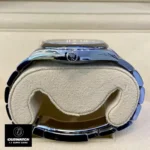 Side profile of the Replica Rolex 124300 with visible crown and smooth lines of the Oyster Perpetual case.