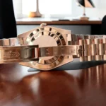 Replica Rolex 228235 Day Date 40 Rose Gold Watch back view, showcasing the detailed craftsmanship and luxurious rose gold case.