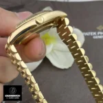 Replica Rolex 228238 Day Date 40 Presidential Watch with a close-up view of the crown, highlighting the iconic design and functionality.