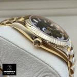 Replica Rolex 228238 Day Date 40 Watch showing the yellow gold case and crown, designed for ultimate luxury and precision.