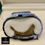 Side view of the Replica Rolex m124300 Oyster Perpetual with Celebration Dial, emphasizing the sleek Oystersteel case.