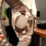 Super Clone Rolex Chocolate Dial Day Date 40 Watch back view，showcasing the intricate details and polished rose gold case