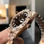 Super Clone Rolex Chocolate Dial Day Date 40 Watch side view showing the rose gold case and finely crafted crown.