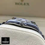 Super clone Rolex Datejust 126334 Blue Dial Watch side view with attention to the crown and smooth Oystersteel case.