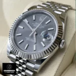 Replica Rolex Datejust Grey Dial 126334 Watch at a 45-degree angle, highlighting the grey dial, fluted bezel, and polished stainless steel case.