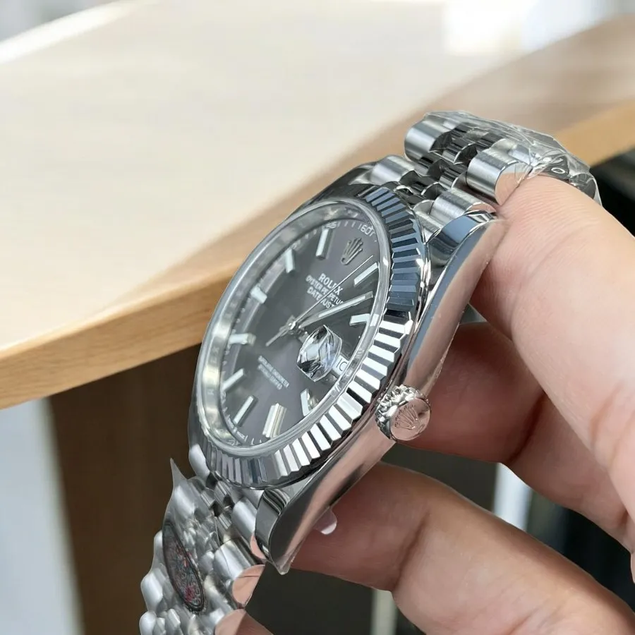 Replica Rolex Datejust Grey Dial 126334 Watch side view with focus on the crown and the sleek, polished Oystersteel case.