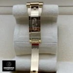 Replica Rolex Day Date 40 Yellow Gold Watch with a concealed folding Crownclasp for added elegance and functionality.