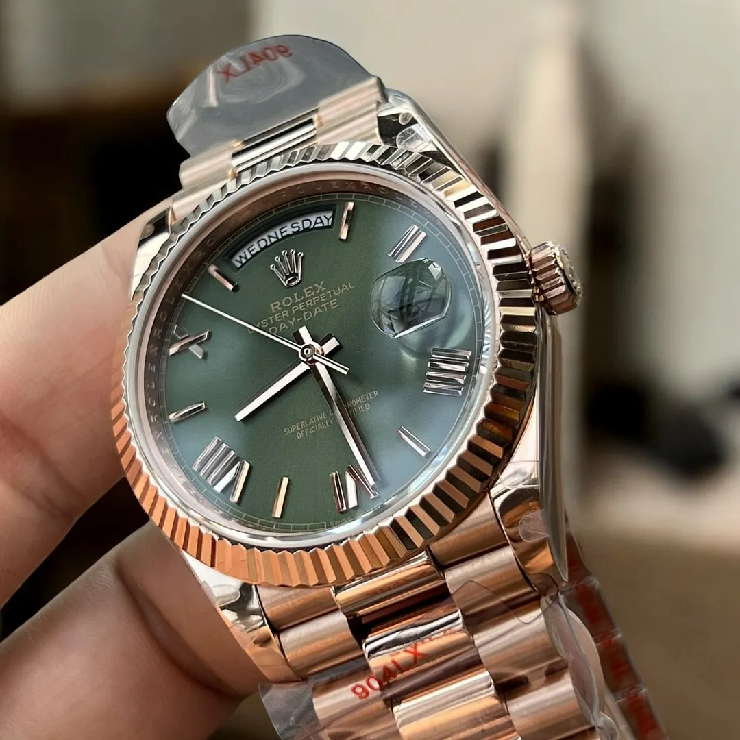 Replica Rolex Day Date Rose Gold 40 228235 Watch with a close-up view of the luxurious green dial, a standout feature of this elegant timepiece.