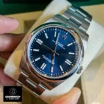 Replica Rolex Oyster Perpetual 41 m124300-0003 watch displayed at a 45-degree angle, highlighting the sharp details of the blue dial and sturdy Oystersteel case.