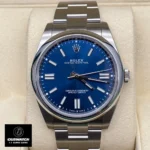 Replica Rolex Oyster Perpetual Blue Dial m124300 watch shown from the front, featuring the rich blue dial and Oystersteel construction for a sleek look.