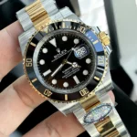 120-degree angle display of Rolex Submariner 116613LN watch with black dial, bezel, and two-tone bracelet