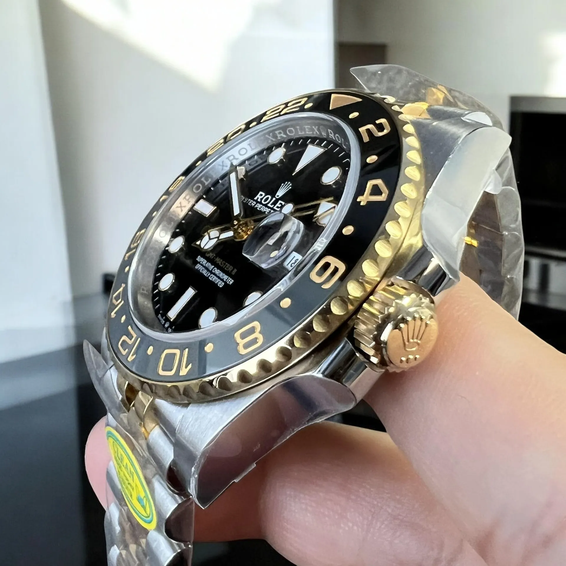 Super Clone Rolex Watch Black and Gold 126713GRNR Cerachrom Bezel, Crown Close-Up.