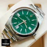 Replica Rolex watch with green face m124300 displayed at a 45-degree angle