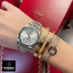 Replica Rolex Oyster Perpetual 124300 watch worn on the wrist, offering a perfect view of its refined design and classic appeal.