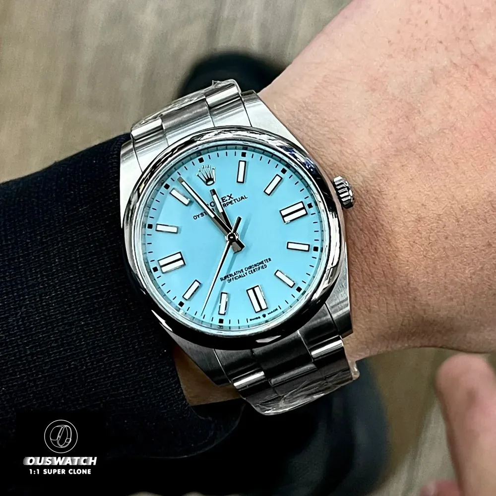 Replica Rolex Tiffany Blue Dial 124300-0006 worn on the wrist, demonstrating the elegant design and striking blue dial.