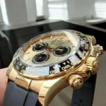 Super Clone Rolex Daytona Yellow Gold Watch case and button close-up.