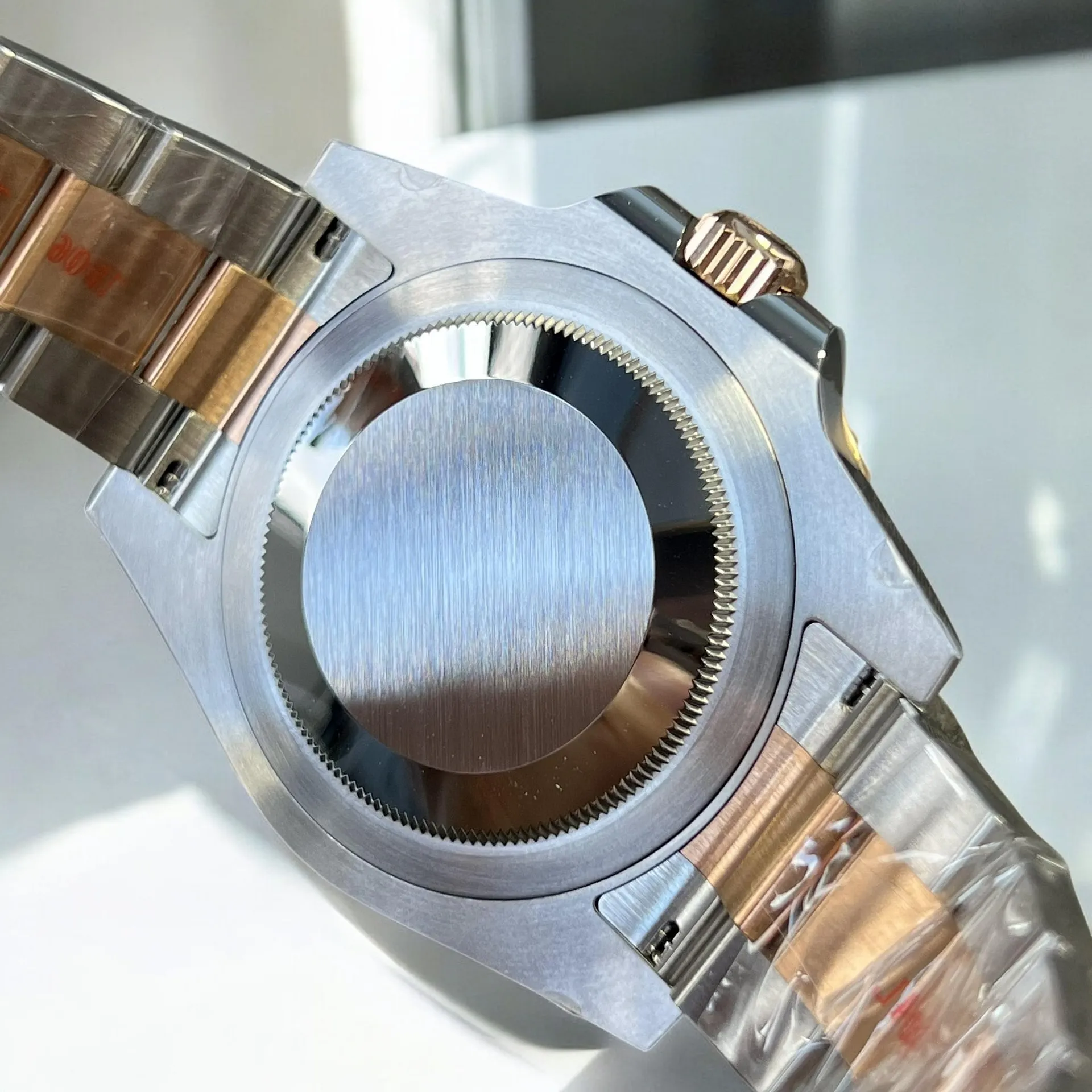 Super Clone Rolex GMT Root Beer 126711CHNR back view, showcasing the case back design.