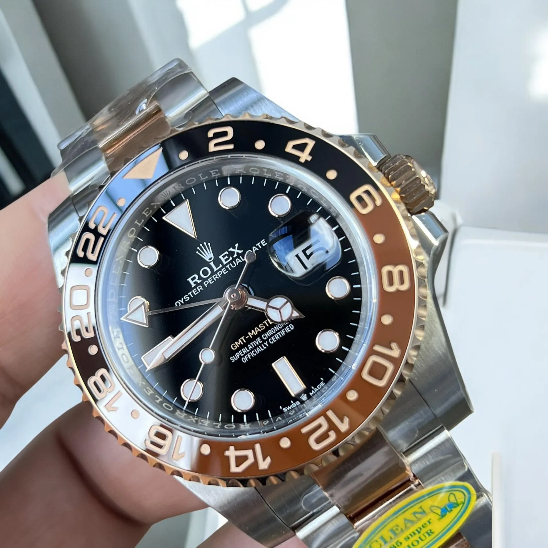 Super Clone Rolex GMT Root Beer 126711CHNR close-up of the black dial.