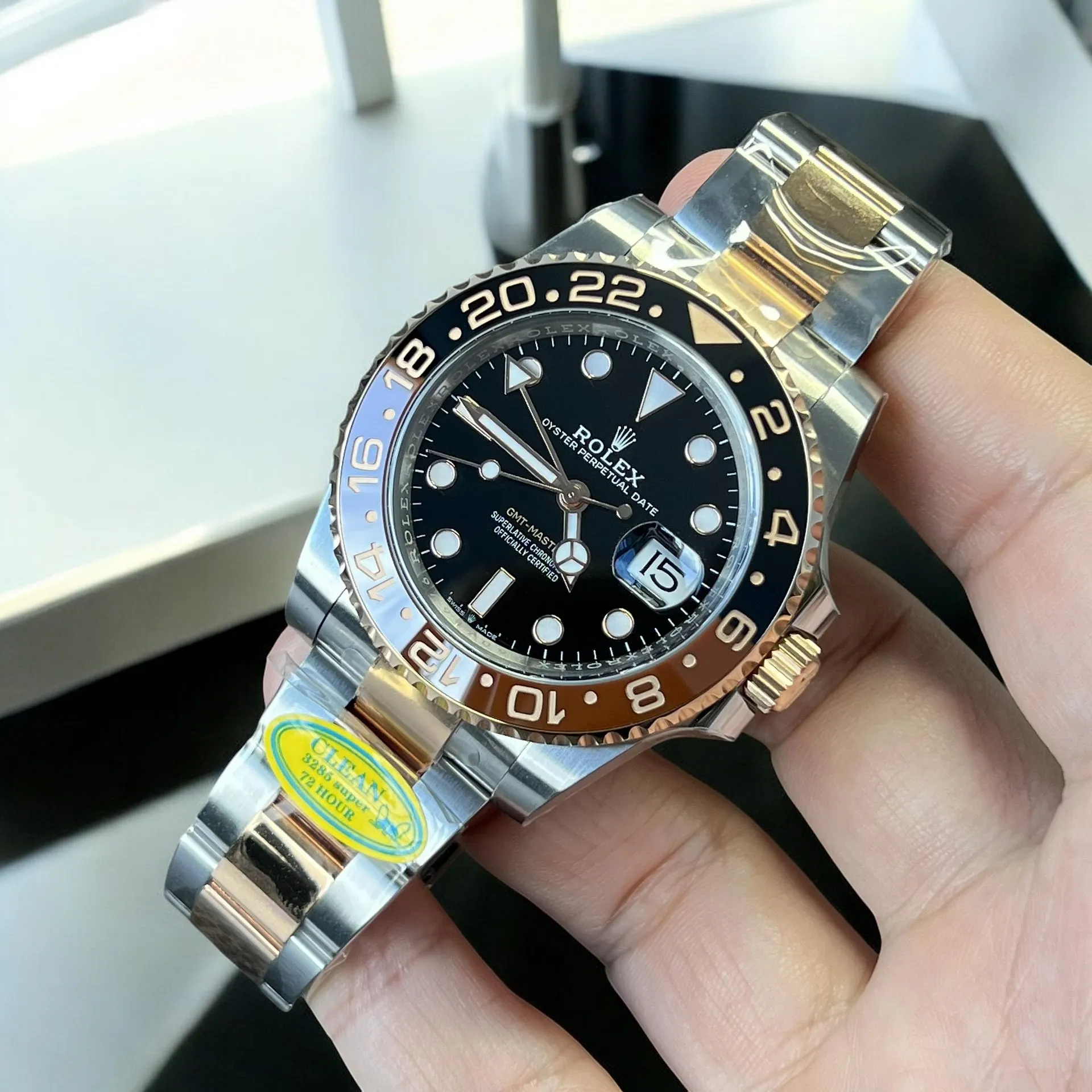 Super Clone Rose Gold Root Beer 126711CHNR front view, displaying the black dial and brown-black two-tone bezel.