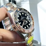 Super Clone Rolex GMT Master II Root Beer side view, emphasizing the Oystersteel and Everose gold case.