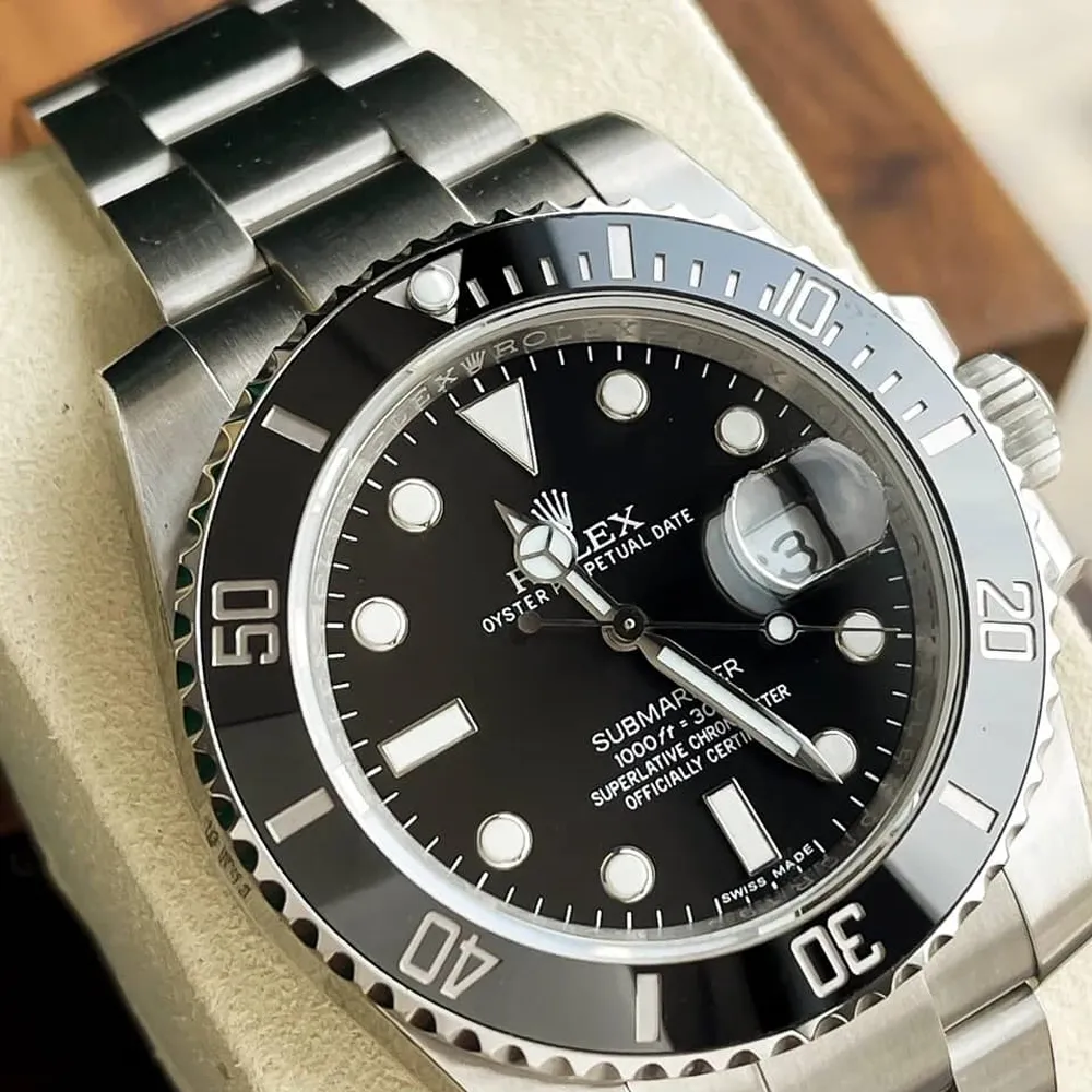 Close-up of Rolex Submariner Date 126610LN highlighting its stainless steel case and classic black dial.
