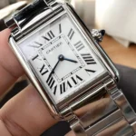 Close-up shot at a 120-degree angle of the silvered dial on the Cartier Tank Must Large WSTA0052 watch dupe, emphasizing the blued-steel sword-shaped hands