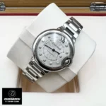 45-degree angled shot of diamond-accented watch face with sword-shaped hands