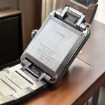 Rear view of the Cartier Tank WSTA0052 watch dupe, displaying the smooth stainless steel case back and bracelet attachment points.