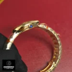 Cartier Baignoire WGBA0013 watch dupe featuring signature blue sapphire crown