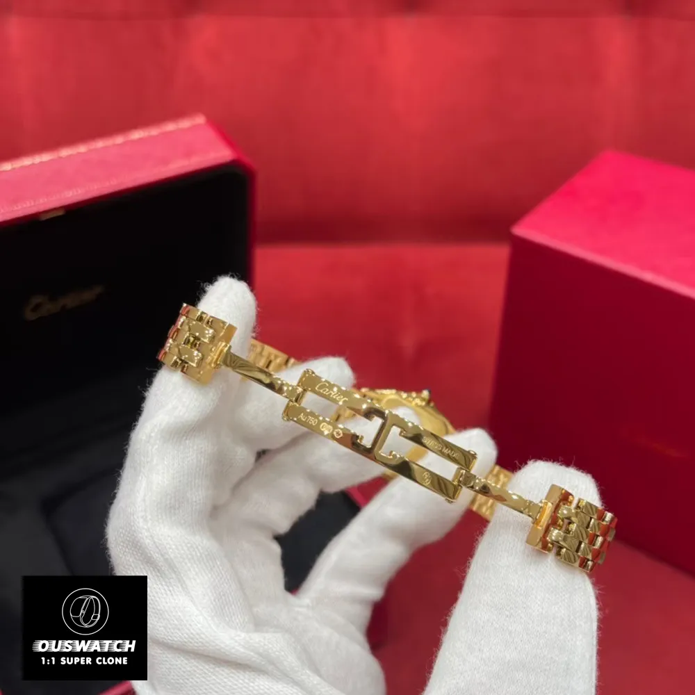 Deployant clasp detail on luxury watch dupe - Double safety push-button release with 18K gold plating