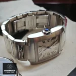 Detailed view of Cartier Tank Francaise WSTA0067 super clone watch showcasing the stainless steel case, faceted crown with synthetic spinel, and matching bracelet.